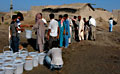 PUR sachets distribution in Songopur, Sindh Province, Pakistan. Three months after the floods that inundated Pakistan, MSF has stopped the emergency response activities in some parts of the country, such as in Khyber Pakhtunkhwa and in northern Sindh provinces, where flood-affected people have started returning to their homes. However, in southern Sindh and esasten Balochistan provinces, MSF teams continue to provide medical care, nutrition programs, safe water and transitional shelters to the affected population. Photo: © Damien Follet